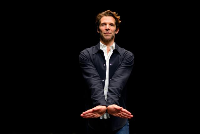Julien Favreau, artistic director of the 'Bejart Ballet Lausanne' (BBL) of Switzerland, poses during an interview on the sidelines of the three unique ballets brought together at Zorlu Performing Arts Center (PSM) in Istanbul on February 20, 2026. Thirty-six dancers with raised arms glide slowly forward as they encircle their prey, a lone figure on a red table in a climactic scene from Ravel's "Bolero" choreographed by Maurice Bejart. (Photo by Yasin AKGUL / AFP)