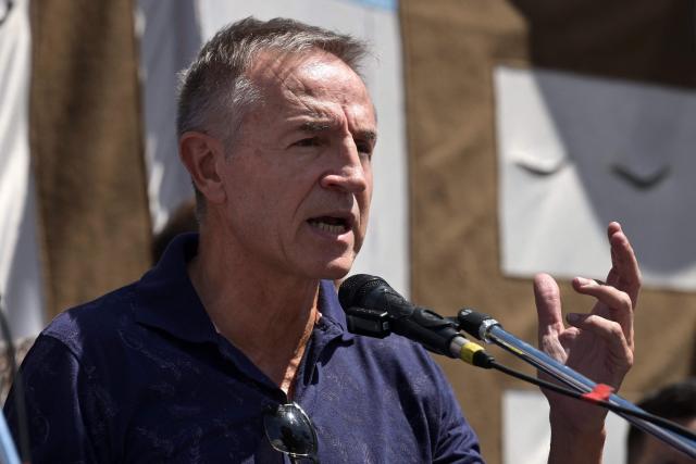 Jorge Sola, one of the three leaders of Argentina's General Confederation of Labor (CGT) speaks during a protest of judicial employees of labor courts against a labor reform promoted by Argentine President Javier Milei outside the courthouse in Buenos Aires on February 24, 2026. (Photo by JUAN MABROMATA / AFP)
