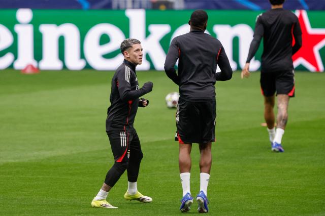 SL Benfica's Argentine forward #25 Gianluca Prestianni (L) attends a training session on the eve of their UEFA Champions League knockout round play-off second leg football match against Real Madrid CF at Santiago Bernabeu Stadium in Madrid on February 24, 2026. (Photo by Oscar DEL POZO / AFP)