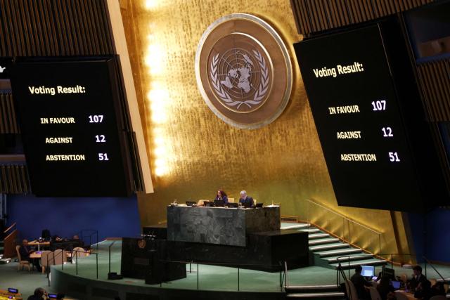 A screen displays the voting results approving a draft resolution in support of lasting peace in Ukraine during the United Nations General Assembly meeting on Ukraine at UN Headquarters in New York, on February 24, 2026. February 24, 2026 marks the fourth anniversary of Russia's war against Ukraine. (Photo by Leonardo Munoz / AFP)