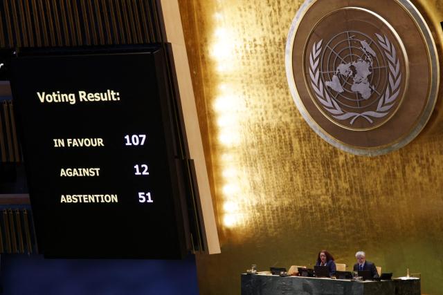 A screen displays the voting results approving a draft resolution in support of lasting peace in Ukraine during the United Nations General Assembly meeting on Ukraine at UN Headquarters in New York, on February 24, 2026. February 24, 2026 marks the fourth anniversary of Russia's war against Ukraine. (Photo by Leonardo Munoz / AFP)