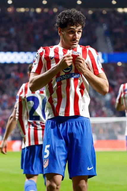 Atletico Madrid's US midfielder #05 Johnny Cardoso celebrates scoring his team's second goal during the UEFA Champions League knockout round play-off second leg football match between Club Atletico de Madrid and Club Brugge KV at Metropolitano Stadium in Madrid on February 24, 2026. (Photo by Pierre-Philippe MARCOU / AFP)