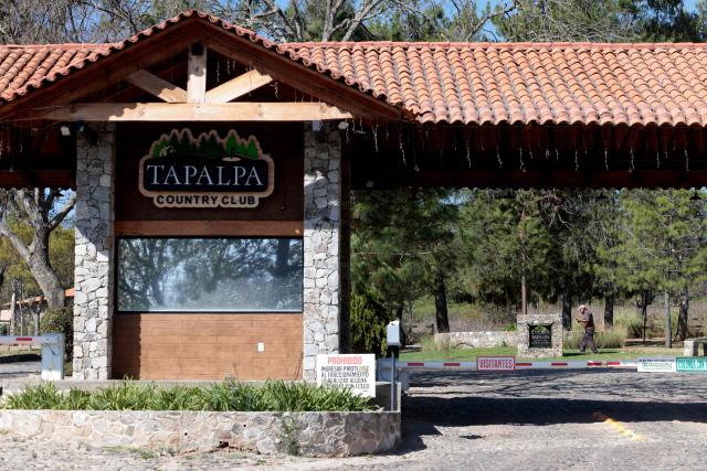 View of the main entrance of the “Tapalpa Country Club”, where Colombian drug lord "El Mencho” was hiding at the moment of the operation in which he was killed, in Tapalpa, Jalisco state, Mexico, on February 24, 2026. Residents of Jalisco cautiously peeked their heads out on February 23, 2026 after waves of retaliatory cartel violence rocked the Mexican state over the weekend following the death of a major drug kingpin. (Photo by Ulises RUIZ / AFP)