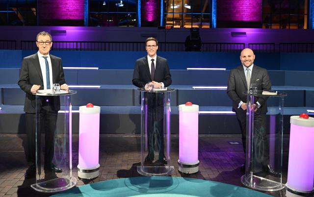 (L-R) Cem Ozdemir, top candidate of the Greens, Manuel Hagel top candidate of Christian Democratic Union (CDU) and Markus Frohnmaier, top candidate of the far-right Alternative for Germany (AfD) pose for a photo ahead of a TV debate of the parties' top candidates in the upcoming State election in Baden-Wuerttemberg in Stuttgart, southern Germany, on February 24, 2026. State elections are set to take place on March 8, 2026 in Baden-Wuerttemberg. (Photo by THOMAS KIENZLE / AFP)