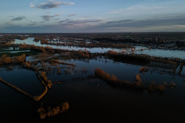 This aerial view shows flood water following severe flooding from storm Nils in Champtocé sur Loire, south-western France, on February 24, 2026. (Photo by Philippe LOPEZ / AFP)