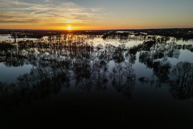 This aerial view shows flood water following severe flooding from storm Nils in Champtocé sur Loire, south-western France, on February 24, 2026. (Photo by Philippe LOPEZ / AFP)