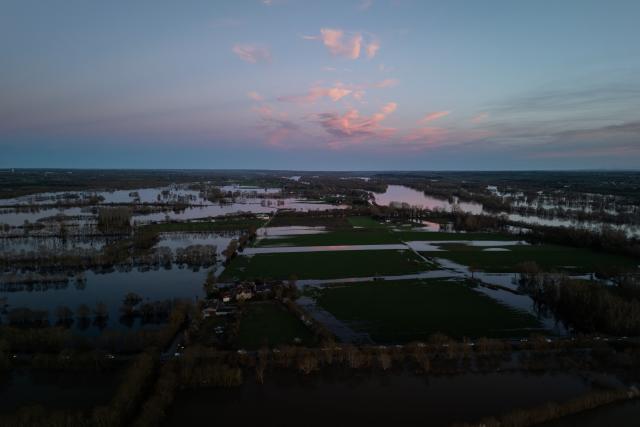 This aerial view shows flood water following severe flooding from storm Nils in Champtocé sur Loire, south-western France, on February 24, 2026. (Photo by Philippe LOPEZ / AFP)