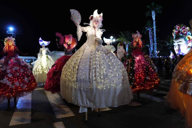 Artists perform during the 141th edition of the Nice Carnival in the French Riviera City of Nice on February 24, 2026. The edition 2026 of the Nice Carnival, whose theme is "Long live the Queen", takes place until March 1, 2026. (Photo by Valery HACHE / AFP)