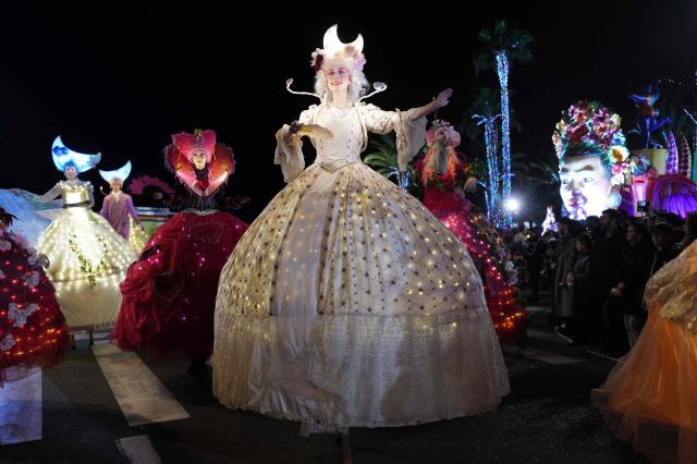 Artists perform during the 141th edition of the Nice Carnival in the French Riviera City of Nice on February 24, 2026. The edition 2026 of the Nice Carnival, whose theme is "Long live the Queen", takes place until March 1, 2026. (Photo by Valery HACHE / AFP)