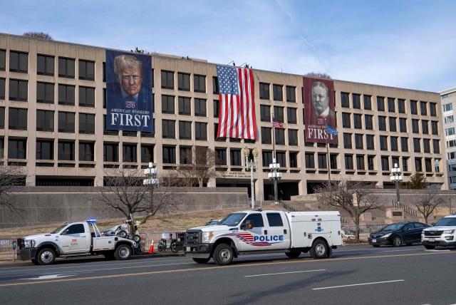 A banner depicting US President Donald Trump is seen on the face of the Labor Department building near the US Capitol ahead of Trump’s State of the Union speech in Washington, DC, on February 24, 2026. (Photo by Ken CEDENO / AFP)