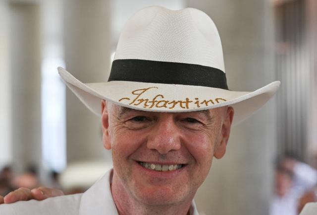 TOPSHOT - FIFA President Gianni Infantino wears a typical Colombian hat reading ‘Infantino’ during his visit to the new Concentration Hotel of the Colombian Football Federation, in Barranquilla, Colombia on February 24, 2026. FIFA boss Gianni Infantino told AFP on February 24, 2026, he was "very reassured" about Mexico's hosting of games in the World Cup, in his first comments on the violence triggered by the killing of a drug cartel leader. (Photo by David SALAZAR / AFP)