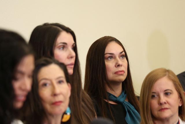 Survivor Haley Robson (2nd R) listens during a press conference for survivors of Jeffrey Epstein held by the Democratic Women's Caucus in advance of US President Donald Trump's State of the Union address in the Cannon Office Building on Capitol Hill in Washington, DC, on February 24, 2026. (Photo by Alex Wroblewski / AFP)