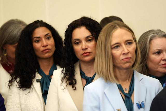 Epstein survivors stand alongside each other and supporters at a press conference for Epstein survivors held by the Democratic Women's Caucus in advance of President Donald Trump's State of the Union address on Capitol Hill in Washington, DC, on February 24, 2026. (Photo by Alex Wroblewski / AFP)