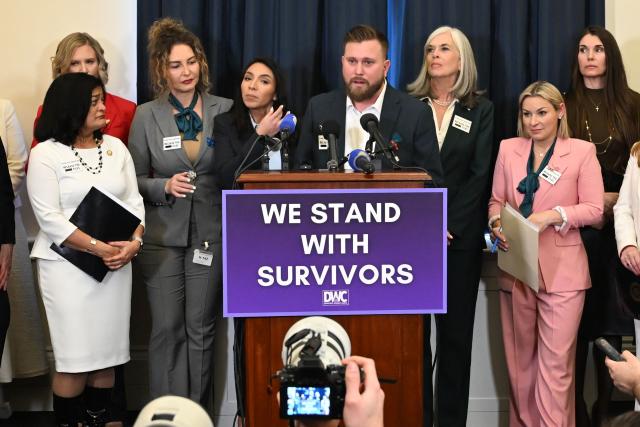 Sky Roberts (C-R), brother of Virginia Giuffre, who was abused by Jeffrey Epstein, speaks alongside his wife Amanda Roberts (C-L) at a press conference for Epstein survivors held by the Democratic Women's Caucus in advance of President Donald Trump's State of the Union address on Capitol Hill in Washington, DC, on February 24, 2026. (Photo by Alex Wroblewski / AFP)