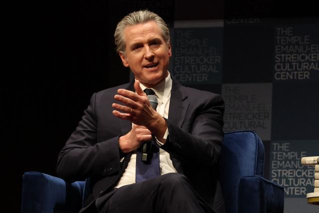 California Governor Gavin Newsom speaks with Harry Sisson to promote his book, "Young Man in a Hurry" at the Streicker Cultural Center, in New York, on February 24, 2026. (Photo by TIMOTHY A. CLARY / AFP)