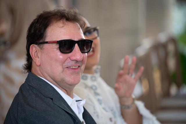 Colombia's national football team coach, Argentine Nestor Lorenzo, smiles during the visit of FIFA President Gianni Infantino to the new Concentration Hotel of the Colombian Football Federation in Barranquilla, Colombia, on February 24, 2026. FIFA boss Gianni Infantino told AFP on February 24, 2026, he was "very reassured" about Mexico's hosting of games in the World Cup, in his first comments on the violence triggered by the killing of a drug cartel leader. (Photo by David SALAZAR / AFP)