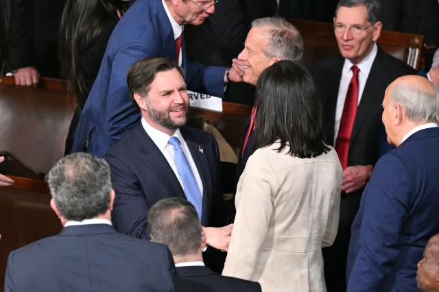 US Vice President JD Vance (L) arrives for US President Donald Trump's State of the Union address in the House Chamber of the US Capitol in Washington, DC, on February 24, 2026. (Photo by Mandel NGAN / AFP)