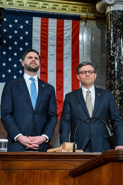 US Vice President JD Vance and Speaker Mike Johnson look on before President Donald Trump delivers the first State of the Union address of his second term to a joint session of Congress in the House Chamber of the United States Capitol in Washington, DC, on February 24, 2026. (Photo by Kenny HOLSTON / POOL / AFP)