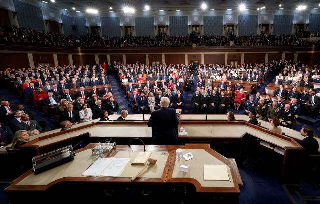 TOPSHOT - US President Donald Trump delivers the State of the Union address to a joint session of Congress in the House Chamber at the US Capitol in Washington, DC, on February 24, 2026. (Photo by Jessica Koscielniak / POOL / AFP)
