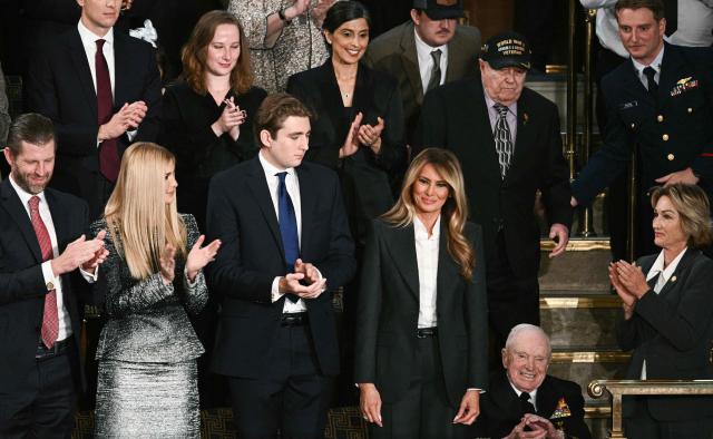 US First Lady Melania Trump stands as she arrives for US President Donald Trump's State of the Union address in the House Chamber of the US Capitol in Washington, DC, on February 24, 2026. (Photo by Brendan SMIALOWSKI / AFP)