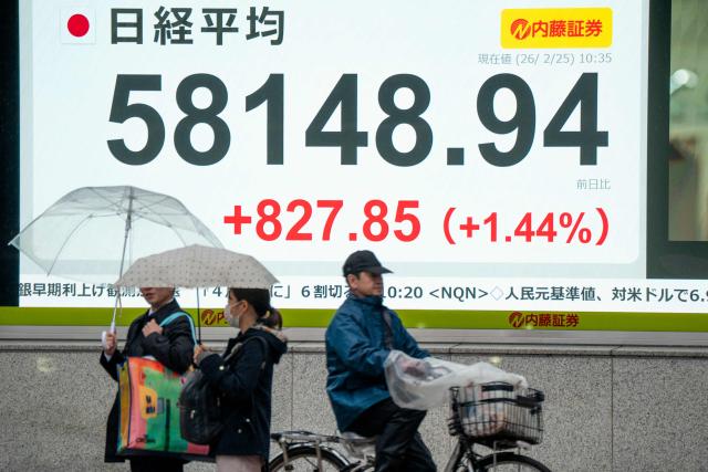 An electronic quotation board displays numbers of the Nikkei Stock Average on the Tokyo Stock Exchange along a street in Tokyo on February 25, 2026. (Photo by Kazuhiro NOGI / AFP)