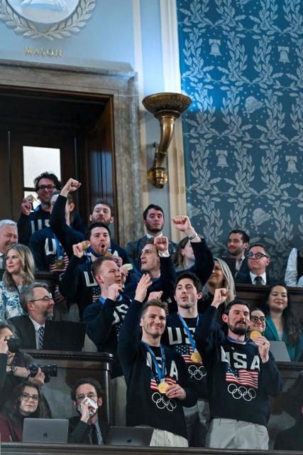 Members of the United States Olympic Men’s Ice Hockey Teamare seen in the gallery as President Donald J. Trump delivers the first State of the Union address of his second term to a joint session of Congress in the House Chamber of the United States Capitol in Washington, DC, on February 24, 2026. (Photo by Kenny HOLSTON / POOL / AFP)