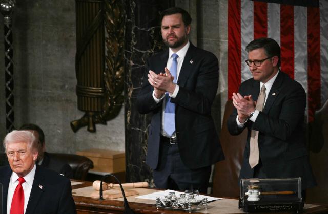 US Vice President JD Vance (L) and Speaker of the House Mike Johnson applaud as US President Donald Trump delivers the State of the Union address in the House Chamber of the US Capitol in Washington, DC, on February 24, 2026. (Photo by Brendan SMIALOWSKI / AFP)