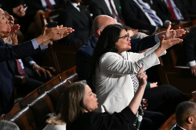 US Representative Rashida Tlaib, Democrat from Michigan, and Democratic members of Congress react as US President Donald Trump delivers the State of the Union address in the House Chamber of the US Capitol in Washington, DC, on February 24, 2026. (Photo by ANDREW CABALLERO-REYNOLDS / AFP)