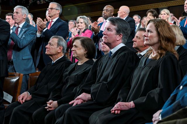 (L/R) US Supreme Court Chief Justice John Roberts, Justice Elena Kagan, Justice Brett Kavanaugh and Justice Amy Coney Barrett watch as President Donald J. Trump delivers the first State of the Union address of his second term to a joint session of Congress in the House Chamber of the United States Capitol in Washington, DC, on February 24, 2026. (Photo by Kenny HOLSTON / POOL / AFP)