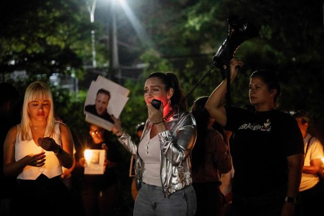 Venezuelan actress Rhoda Torres, mother of a political prisoner, speaks on a megaphone during a vigil outside El Rodeo I prison in Guatire, Miranda state, Venezuela, on February 24, 2026. A total of 179 political prisoners were released from prison in Venezuela under the recently enacted amnesty law, Parliament reported on February 24, as complaints mount about delays in processing the benefit in the courts. (Photo by Maryorin Mendez / AFP)
