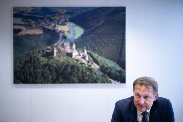 EU Commissioner for Agriculture, Christophe Hansen, speaks during an interview at the EU headquarters in Brussels on February 24, 2026. Forty million euros for French wine producers, and a one-year suspension of taxes on part of fertilizer imports: in an interview with AFP, European Commissioner for Agriculture Christophe Hansen highlighted support measures for farmers ahead of his visit to the Agricultural Show on February 24, 2026. (Photo by JOHN THYS / AFP)