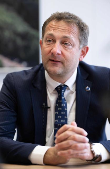EU Commissioner for Agriculture, Christophe Hansen, speaks during an interview at the EU headquarters in Brussels on February 24, 2026. Forty million euros for French wine producers, and a one-year suspension of taxes on part of fertilizer imports: in an interview with AFP, European Commissioner for Agriculture Christophe Hansen highlighted support measures for farmers ahead of his visit to the Agricultural Show on February 24, 2026. (Photo by JOHN THYS / AFP)