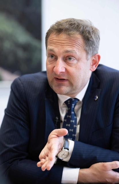 EU Commissioner for Agriculture, Christophe Hansen, speaks during an interview at the EU headquarters in Brussels on February 24, 2026. Forty million euros for French wine producers, and a one-year suspension of taxes on part of fertilizer imports: in an interview with AFP, European Commissioner for Agriculture Christophe Hansen highlighted support measures for farmers ahead of his visit to the Agricultural Show on February 24, 2026. (Photo by JOHN THYS / AFP)