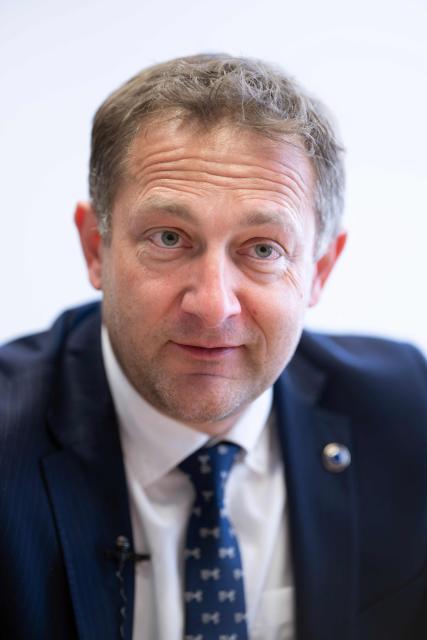 EU Commissioner for Agriculture, Christophe Hansen, speaks during an interview at the EU headquarters in Brussels on February 24, 2026. Forty million euros for French wine producers, and a one-year suspension of taxes on part of fertilizer imports: in an interview with AFP, European Commissioner for Agriculture Christophe Hansen highlighted support measures for farmers ahead of his visit to the Agricultural Show on February 24, 2026. (Photo by JOHN THYS / AFP)