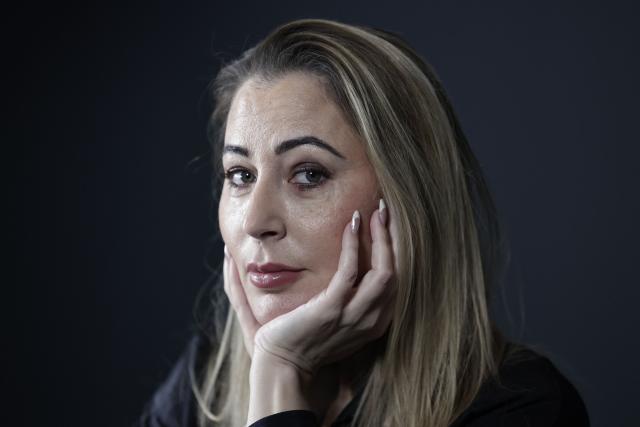 French influencer agent Magali Berdah poses during a photo session in Paris on February 24, 2026. "A death sentence" that "isn't limited to the web": influencer agent Magali Berdah, whose complaint against French rapper Booba led to a trial, describes the devastating impact of cyberbullying on her life, encouraging victims to seek justice. (Photo by STEPHANE DE SAKUTIN / AFP)