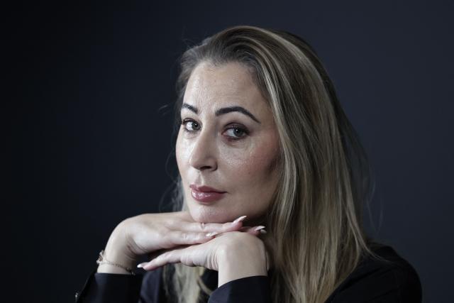 French influencer agent Magali Berdah poses during a photo session in Paris on February 24, 2026. "A death sentence" that "isn't limited to the web": influencer agent Magali Berdah, whose complaint against French rapper Booba led to a trial, describes the devastating impact of cyberbullying on her life, encouraging victims to seek justice. (Photo by STEPHANE DE SAKUTIN / AFP)