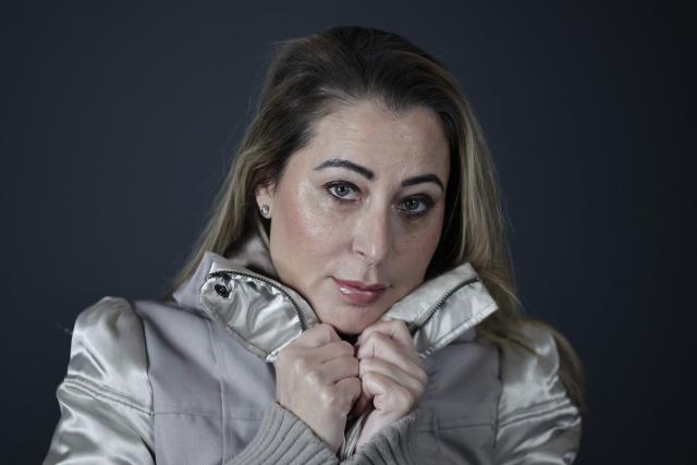 French influencer agent Magali Berdah poses during a photo session in Paris on February 24, 2026. "A death sentence" that "isn't limited to the web": influencer agent Magali Berdah, whose complaint against French rapper Booba led to a trial, describes the devastating impact of cyberbullying on her life, encouraging victims to seek justice. (Photo by STEPHANE DE SAKUTIN / AFP)