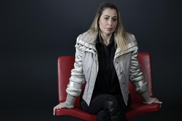 French influencer agent Magali Berdah poses during a photo session in Paris on February 24, 2026. "A death sentence" that "isn't limited to the web": influencer agent Magali Berdah, whose complaint against French rapper Booba led to a trial, describes the devastating impact of cyberbullying on her life, encouraging victims to seek justice. (Photo by STEPHANE DE SAKUTIN / AFP)