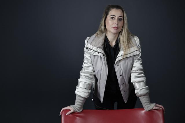 French influencer agent Magali Berdah poses during a photo session in Paris on February 24, 2026. "A death sentence" that "isn't limited to the web": influencer agent Magali Berdah, whose complaint against French rapper Booba led to a trial, describes the devastating impact of cyberbullying on her life, encouraging victims to seek justice. (Photo by STEPHANE DE SAKUTIN / AFP)