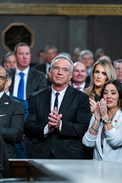 US Health and Human Services Secretary Robert F. Kennedy Jr. watches as President Donald Trump delivers the first State of the Union address of his second term to a joint session of Congress in the House Chamber of the United States Capitol in Washington, DC, on February 24, 2026. (Photo by Kenny HOLSTON / POOL / AFP)