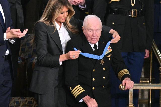 US First Lady Melania Trump presents US veteran Captain E. Royce Williams with the Medal of Honor during US President Donald Trump's the State of the Union address in the House Chamber of the US Capitol in Washington, DC, on February 24, 2026. (Photo by Mandel NGAN / AFP)