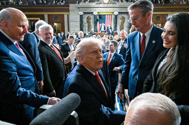 US President Donald Trump exits the House Chamber after delivering the first State of the Union address of his second term to a joint session of Congress in the House Chamber of the United States Capitol in Washington, DC, on February 24, 2026. (Photo by Kenny Holston/The New York Times / POOL / AFP)