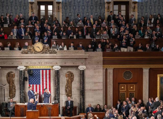 Members of the US Men's Olympic hockey team (top) are recognized by US President Donald Trump as he gestures to them during his State of the Union address in the House Chamber of the US Capitol in Washington, DC, on February 24, 2026. (Photo by ANDREW CABALLERO-REYNOLDS / AFP)