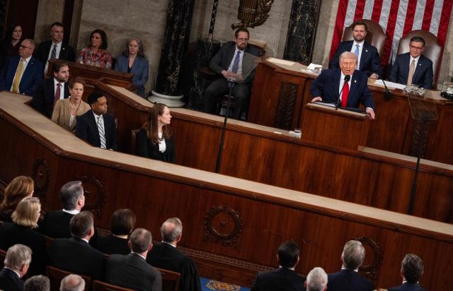 US President Donald Trump addresses a recent Supreme Court decision as he looks at the justices while delivering his State of the Union address in the House Chamber of the US Capitol in Washington, February 24, 2026. (Photo by ANDREW CABALLERO-REYNOLDS / AFP)