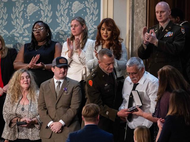 Gary and Evalea Beckstrom, parents of fallen National Guard and Army Specialist Sarah Beckstrom, receive a posthumous Purple Heart during US President Donald Trump's State of the Union address at a joint session of Congress in the US Capitol, Washington, February 24, 2026. (Photo by ANDREW CABALLERO-REYNOLDS / AFP)