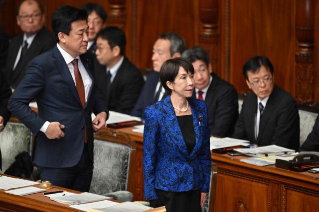 Japan's Prime Minister Sanae Takaichi (front R) attends a plenary session of the House of Representatives in Tokyo on February 25, 2026. (Photo by Kazuhiro NOGI / AFP)