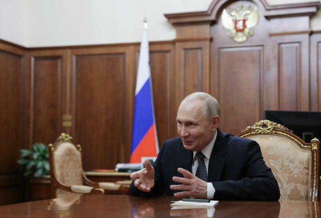 In this pool photograph distributed by the Russian state agency Sputnik, Russia's President Vladimir Putin attends a meeting with General Director of the Bolshoi Theatre in Moscow on February 25, 2026.  (Photo by Gavriil GRIGOROV / POOL / AFP)
