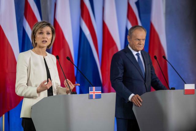 Iceland's Prime Minister Kristrun Frostadottir (L) and Poland's Prime Minister Donald Tusk (R) give a joint press conference following talks in Warsaw on February 25, 2026. (Photo by Wojtek RADWANSKI / AFP)