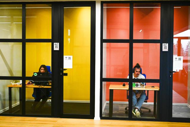 People work in a co-working centre in Bansko on February 13, 2026. Bulgaria's largest ski resort of Bansko in Pirin mountain is becoming a hub for digital nomads, copywriters, enterpreneurs and retirees from around the world. (Photo by Nikolay DOYCHINOV / AFP) / TO GO WITH AFP STORY BY ROSSEN BOSSEV