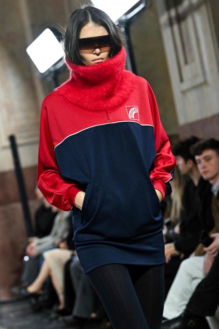 A model presents a creation by MM6 Margiela during a fashion show as part of the Milan Fashion Week Womens-Mens collection Fall-Winter 2026-2027, in Milan on February 25, 2026. (Photo by Andreas SOLARO / AFP)